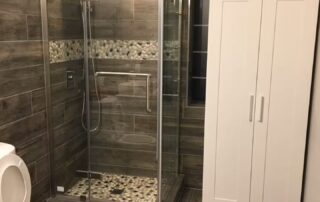 Newly renovated bathroom number 2 with Walk-in Shower, full-size cabinet and waterproof wood-effect panels in the Muskoka Waterfront Cottage Retreat Newly renovated bathroom number 2 with Walk-in Shower, full-size cabinet and waterproof wood-effect panels in the Muskoka Waterfront Cottage Retreat