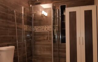 Newly renovated bathroom with Walk-in Shower, full-size cabinet and waterproof wood-effect panels in the Muskoka Waterfront Cottage Retreat Newly renovated bathroom with Walk-in Shower, full-size cabinet and waterproof wood-effect panels in the Muskoka Waterfront Cottage Retreat