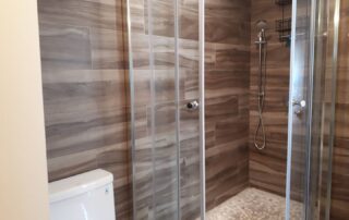 Newly renovated bathroom number 3 with Walk-in Shower, full-size cabinet and waterproof wood-effect panels in the Muskoka Waterfront Cottage Retreat Newly renovated bathroom number 3 with Walk-in Shower, full-size cabinet and waterproof wood-effect panels in the Muskoka Waterfront Cottage Retreat